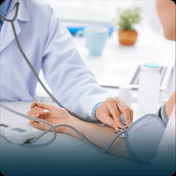 Doctor checking patient blood pressure